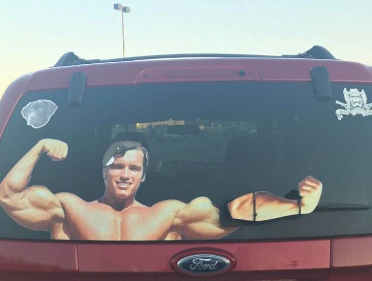 Arnold Schwarzenegger car decal with the forearm zip-tied to the windshield wiper blade