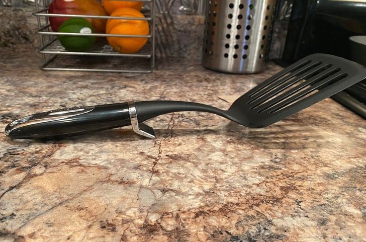 spatula with little stand on counter