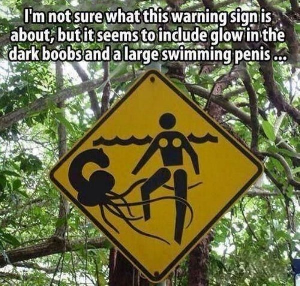 port douglas - I'm not sure what this warning signis about, but it seems to include glow in the dark boobs and a large swimming penis ...