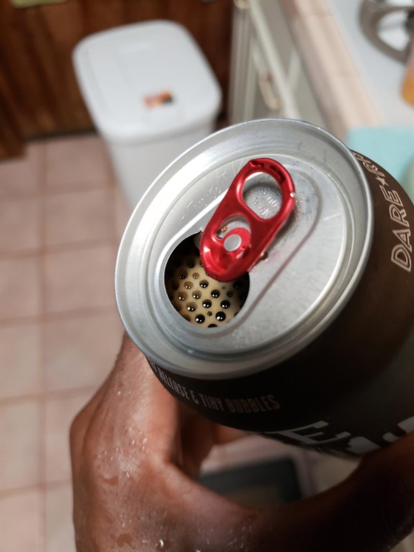 bubbles lined up neatly inside beer can