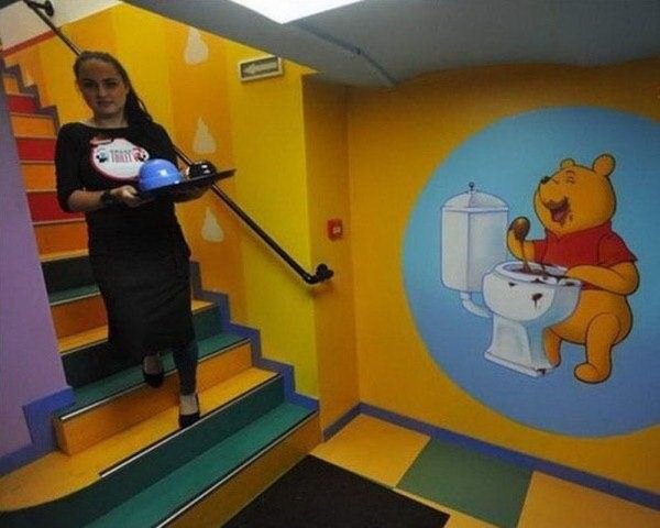 winnie the pooh mural eating poo from a toilet