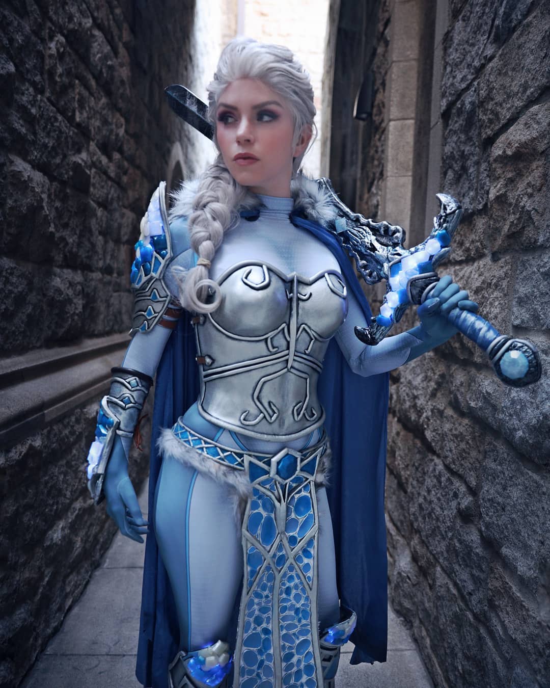 woman wearing blue and silver armor