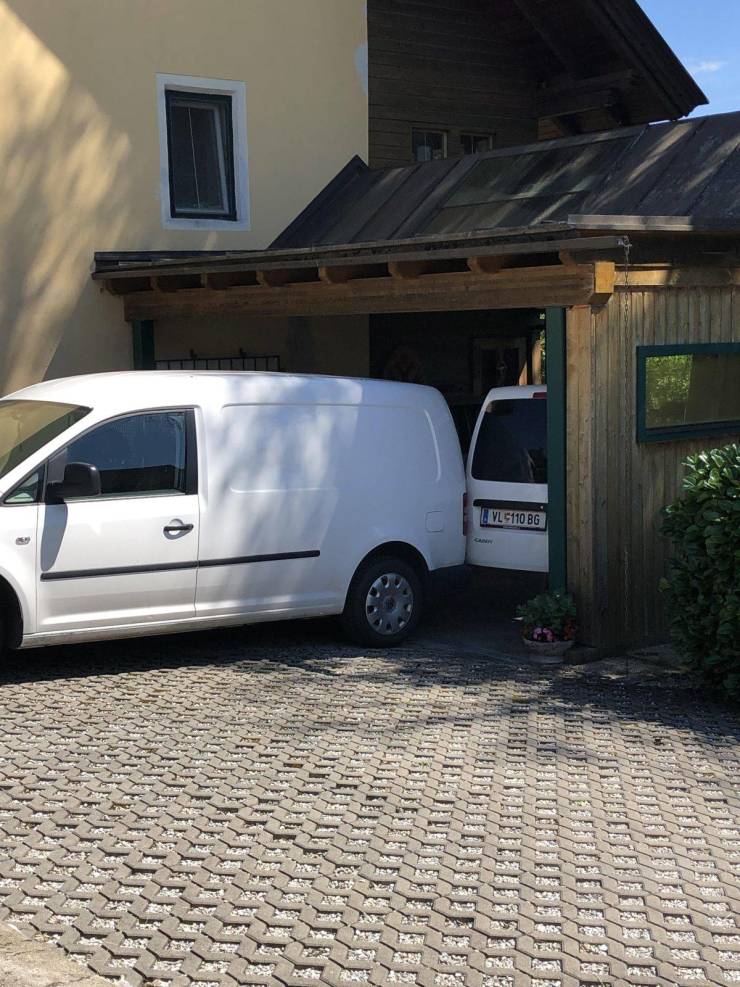 “It looks as if the van is parked really close to another one but it only has its doors open.”