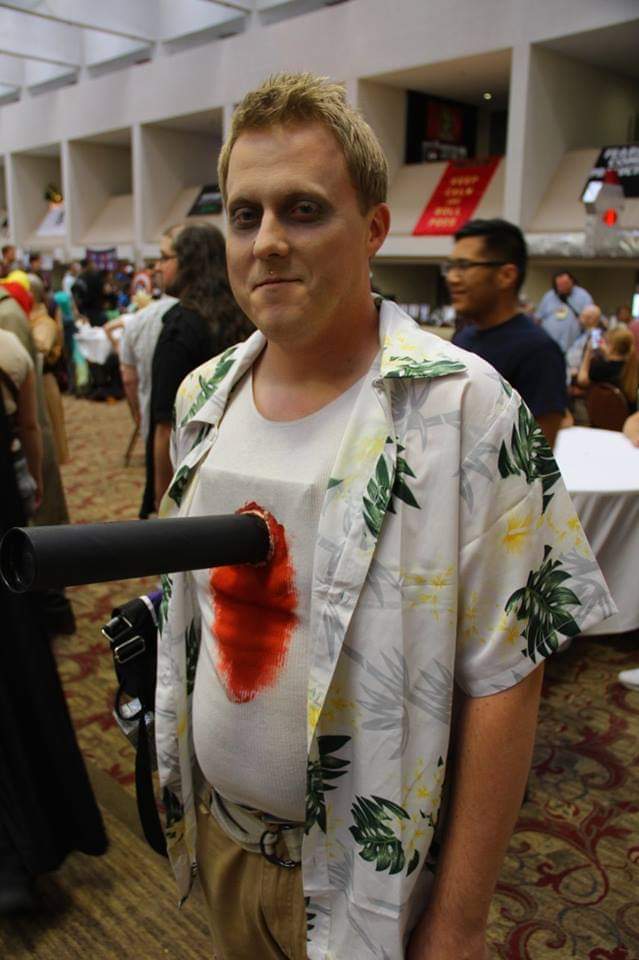 cosplay guy with bleeding pole stuck through his chest