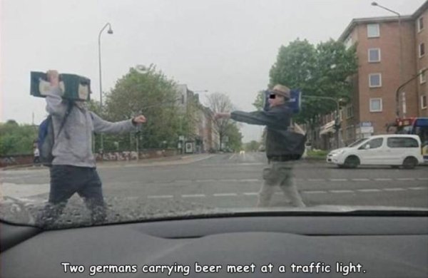 Two germans carrying beer meet at a traffic light.