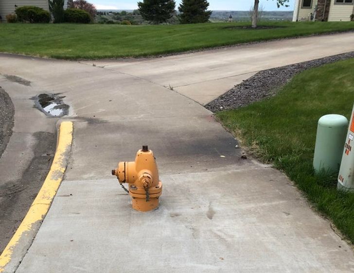 “This fire hydrant where I live is both buried in cement and in the middle of the sidewalk.”