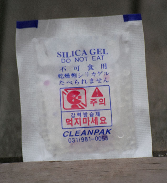 Silica gel packets. You probably know that those little silica gel packets are meant to preserve freshness. There’s no magic here. The packets have silica gel beads inside that absorb humidity in an enclosed environment, protecting products from dampness.Typically, when silica gel packets absorb water, of which they can contain up to 40 percent of their weight, they're no longer effective. However, you can try to restore them by drying them out again in the sun.