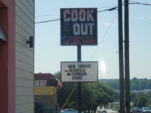 street sign - Cook Out Mest Burgers Belo Hoj Dogs New Chorizo Uesadilla Watermelon Shake Okout