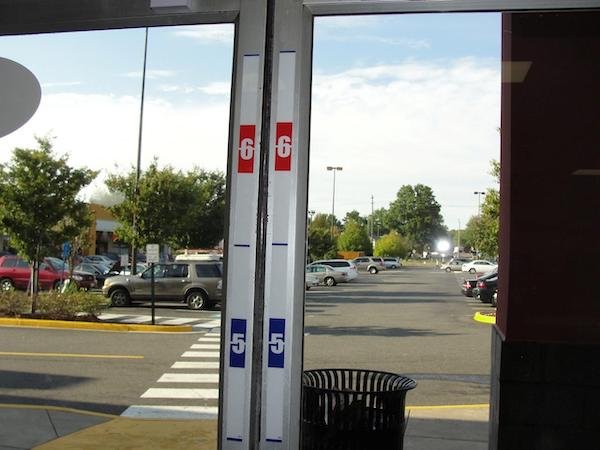 The measuring stick on the inside of gas stations is to measure the height of robbers. It’s not the correct height from ground to ceiling because it is angled for the cameras