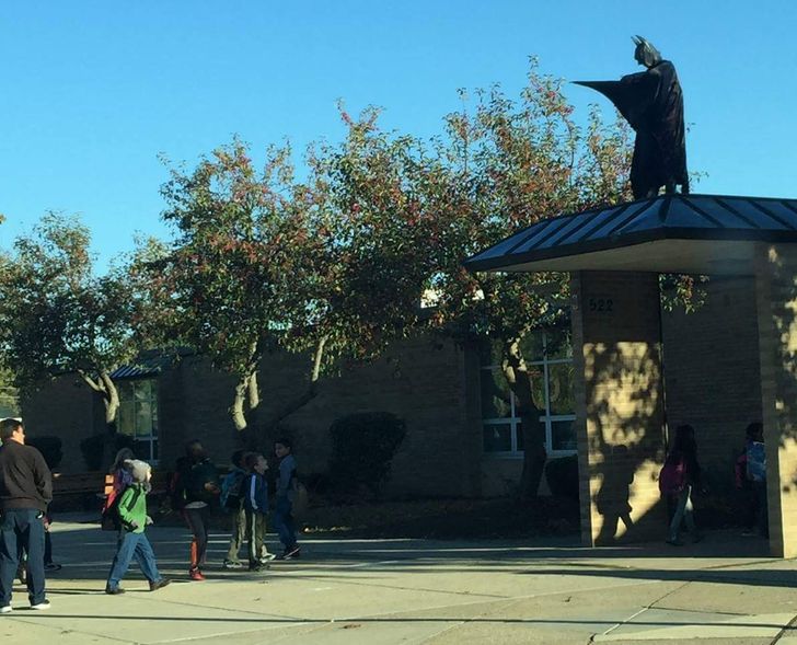principal dresses up as batman for school kids