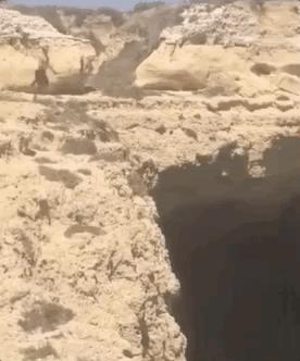 guy falling off a cliff gif