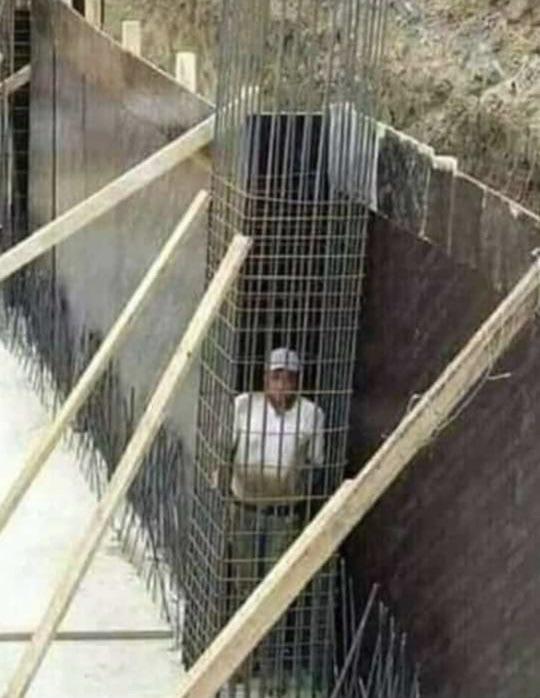 guy trapped in wire cage