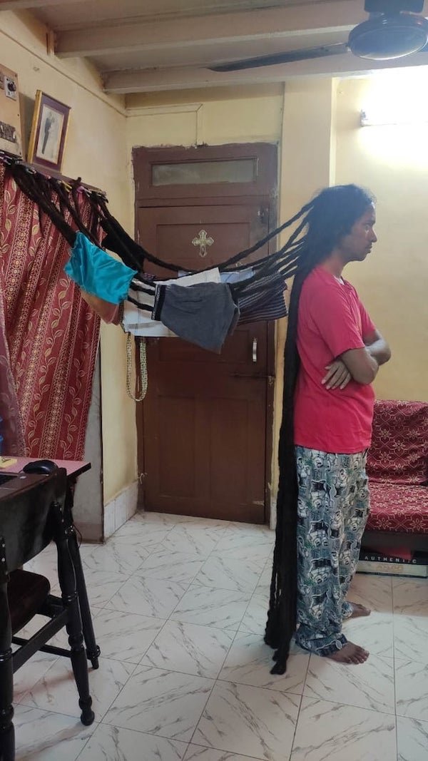 mom tied daughter's hair up for clothes line