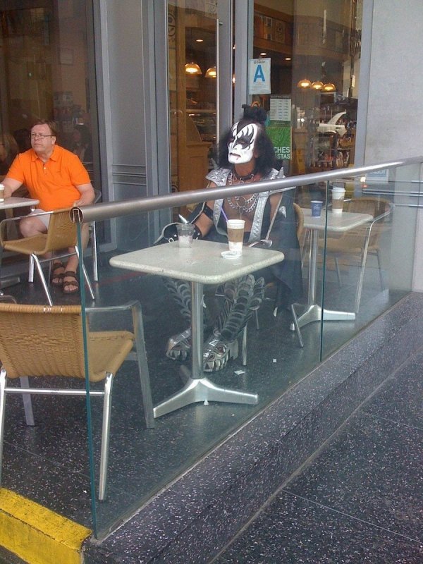 gene simmons from kiss sitting at a cafe