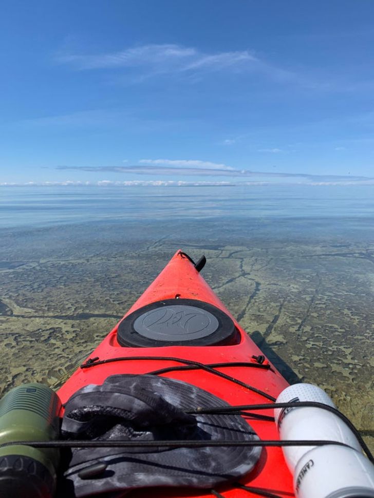 kayak water is so clear it looks like the sky