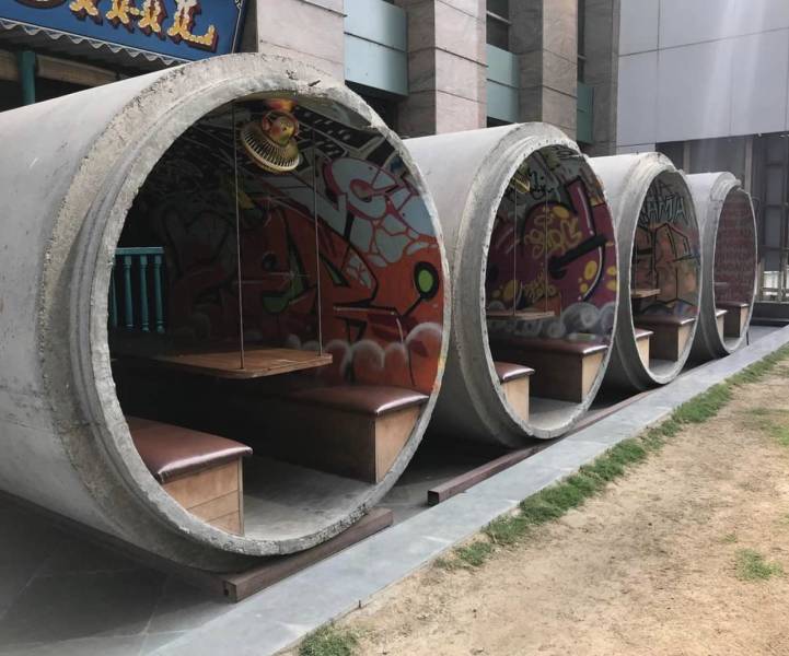 “Concrete sewer pipes used as outdoor seating.”