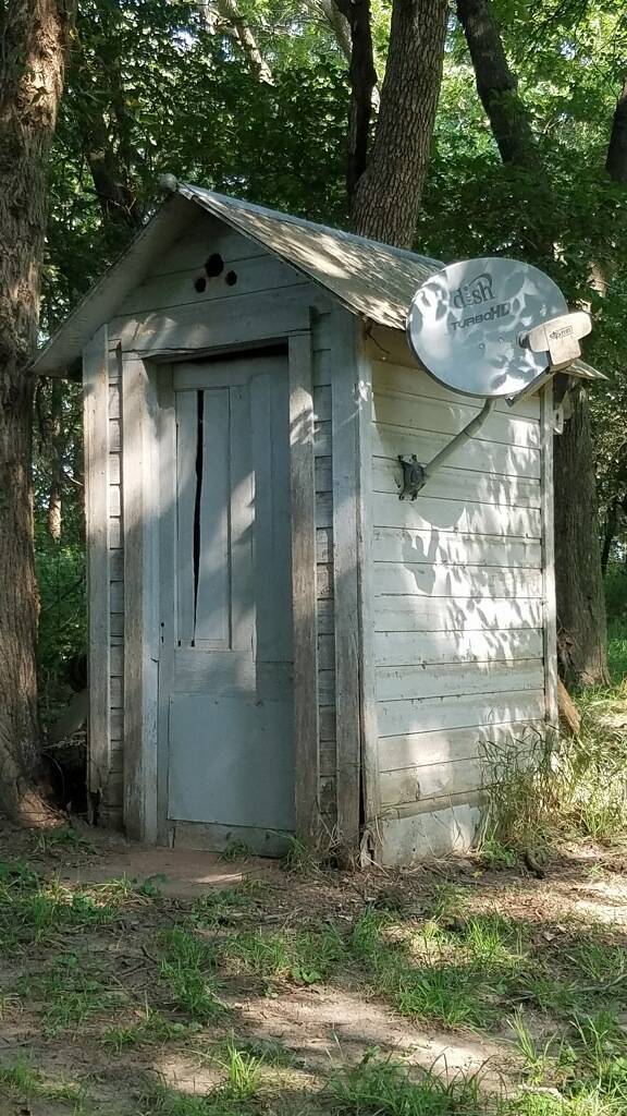 “My dad upgraded the bathroom: 100 year old outhouse now has satellite tv.”