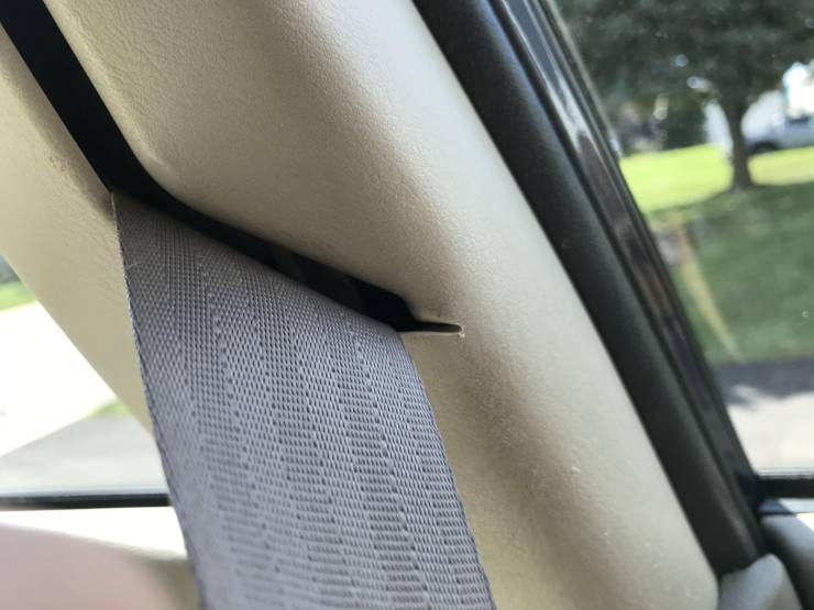 “From years of use the seat belt in my car has slowly cut through the plastic panel.”