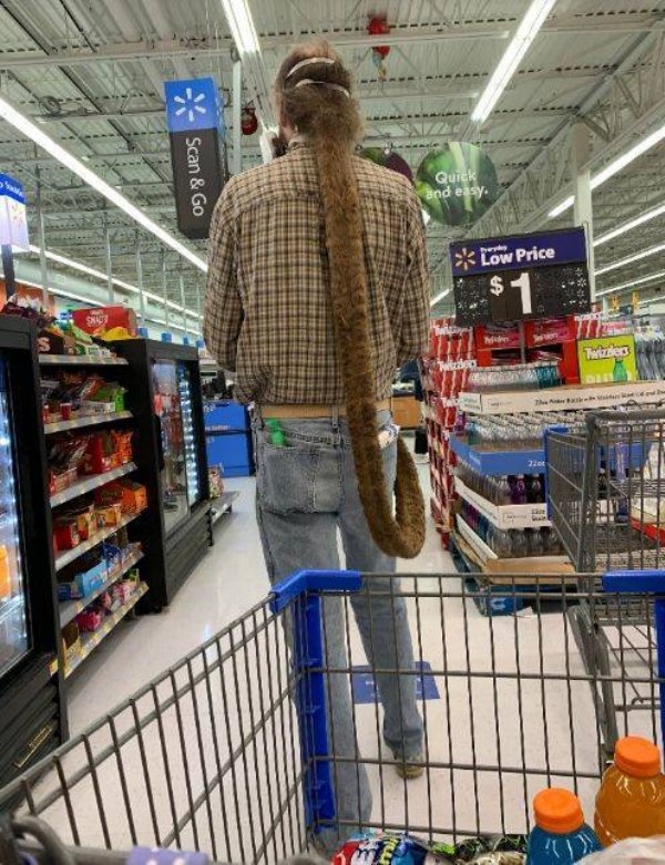 guy with really long rat tail hair in supermarket