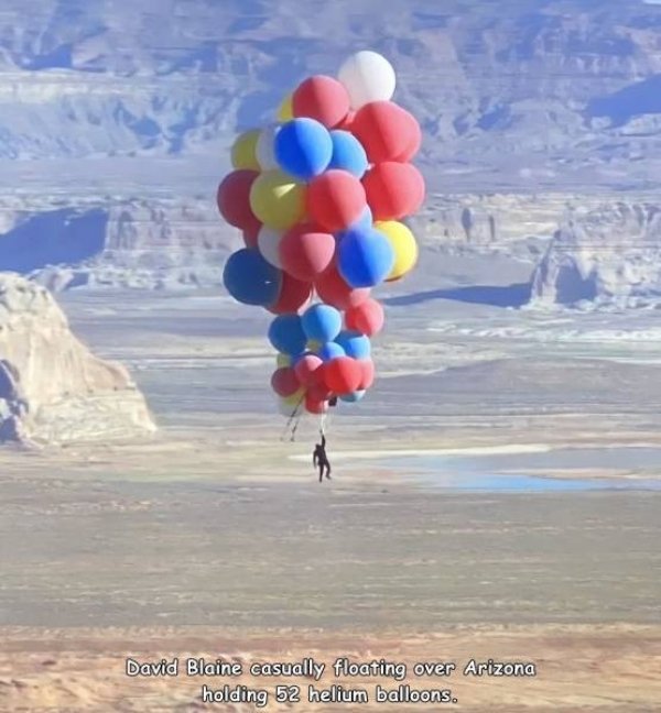 Cluster ballooning - David Blaine casually floating over Arizona holding 52 helium balloons.