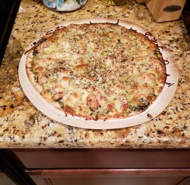 "Pesto pizza camouflaged on the counter."