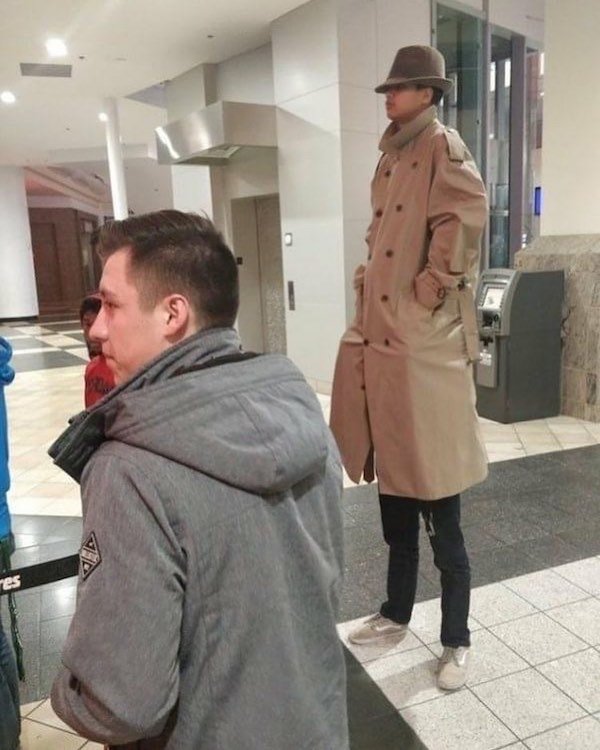 two kids in a trench coat - C