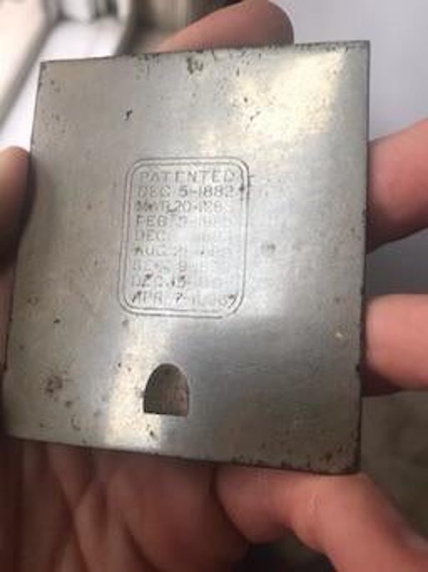 Small metal plate with patent dates from the 1800s. Heavy for its size. Anyone know what it is?

<br/><br/><b>A:</b>  Looks like part of a singer sewing machine.