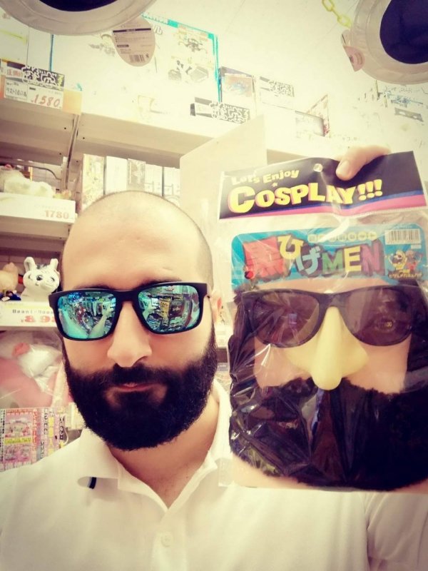 funny memes - guy with glasses and beard holding up costume glasses and beard