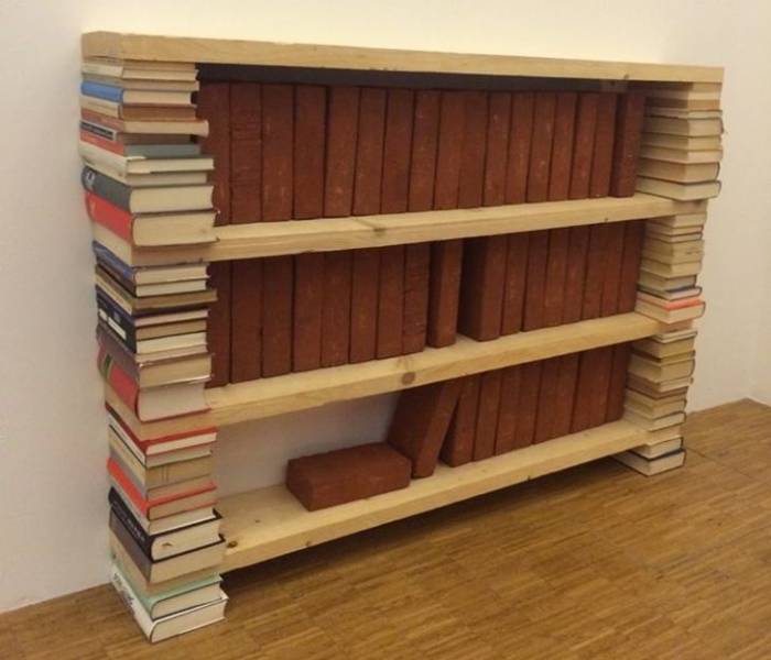 book shelf holding bricks