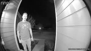 man standing at ring doorbell - ring.com