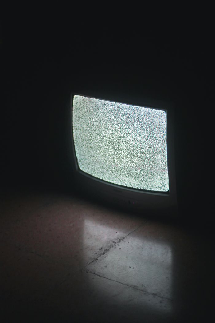 crt tv in dark room