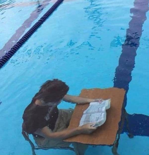 funny meme - guy reading a book under water