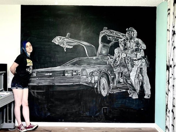 cool pictures -- woman with cool painting of movie back to the future