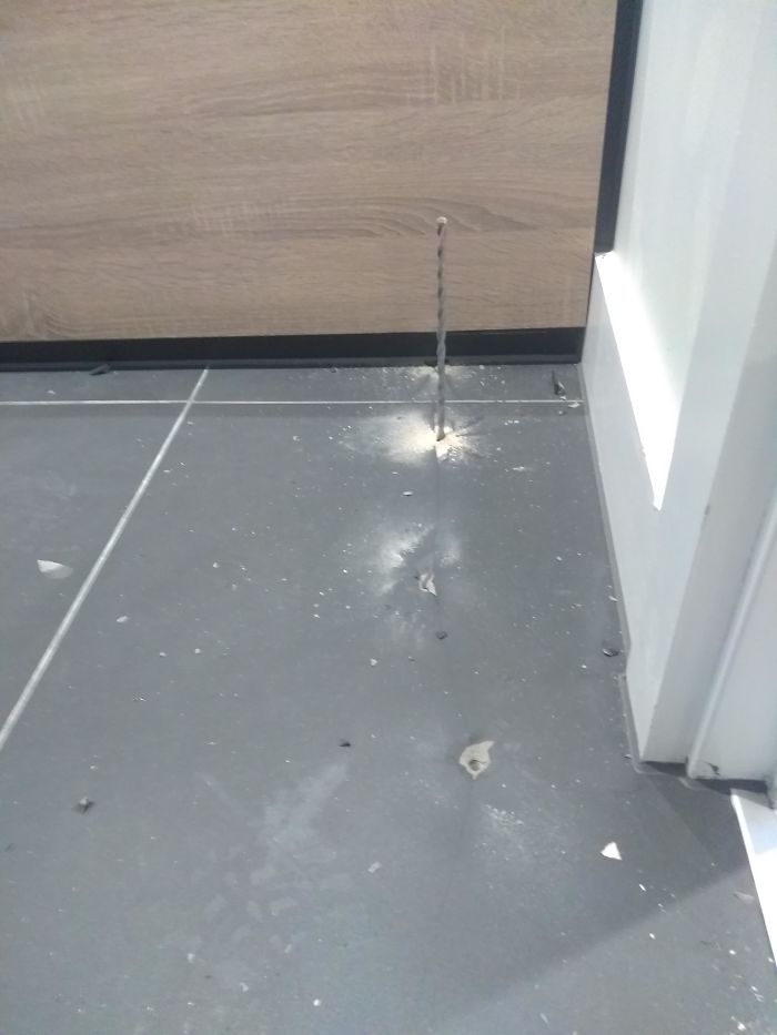 interesting pics - drill bit poking through floor