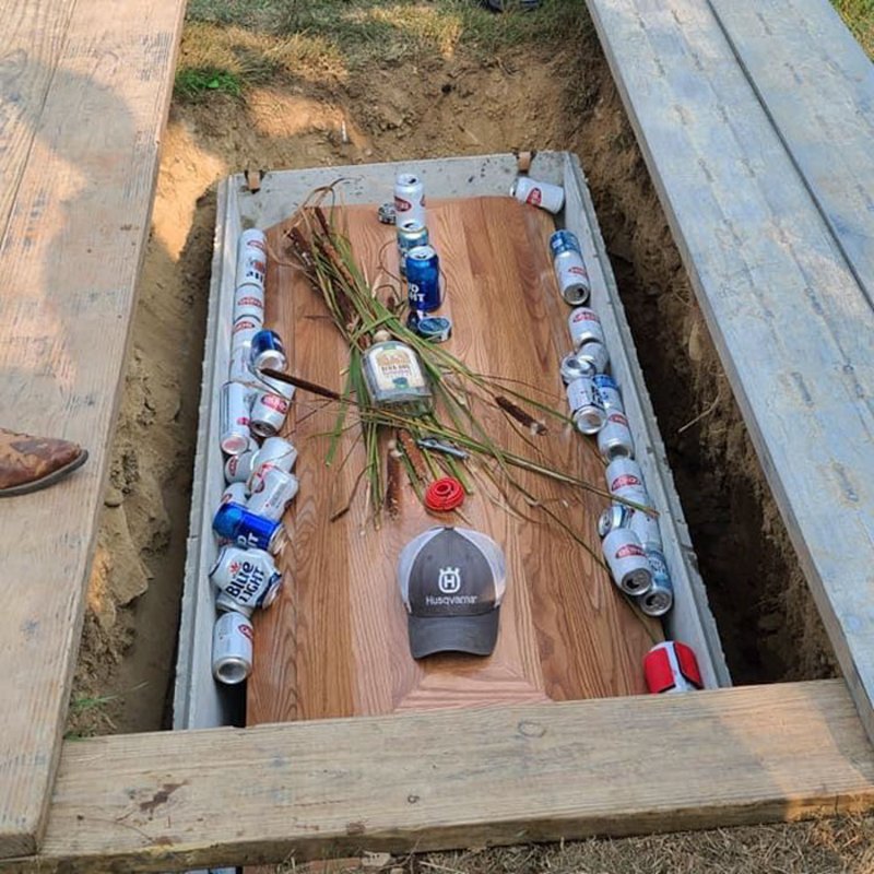 He died in drunk driving accident. He was the drunk driver. This is how his family chose to bury him.