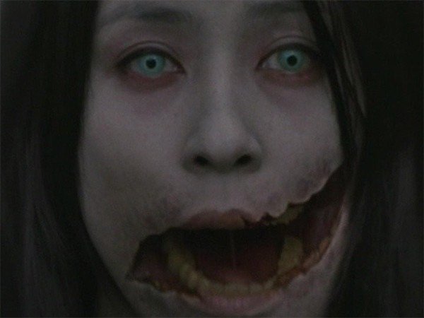 Japan: Kuchisake-Onna.

Kuchisake-Onna (also referred to as “The Slit-Faced Woman”) is one of the most popular urban legends in Japan. According to the legends, Kuchisake-Onna can be found roaming the streets in a surgical mask. If one walks near her, she will stop and ask them if she is pretty. If the person says, “yes,” she will remove her mask to reveal the cuts on her face. She will then ask once more if she is pretty. If you stick with your original answer of “yes,” she is said to cut your mouth to match hers.