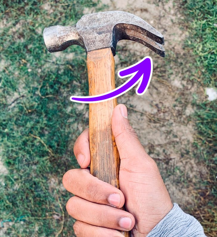 person holding hammer