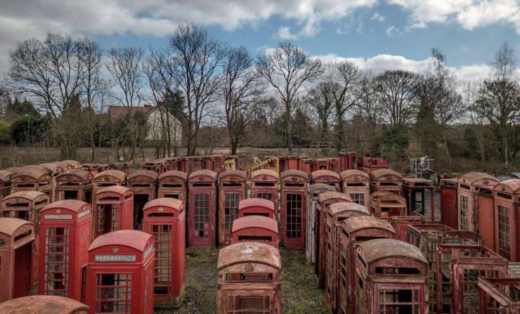 “A telephone booth cemetery on the outskirts of London.”