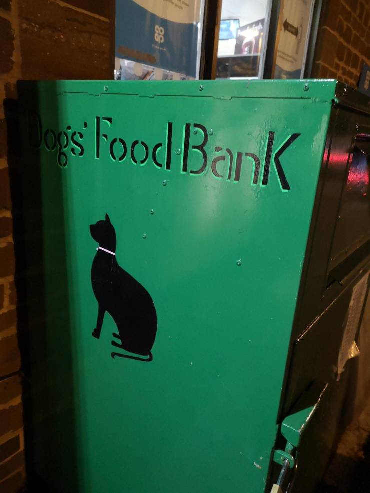 funny pics - dogs food bank with a picture of a cat on it