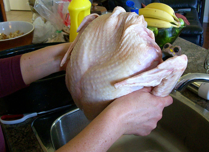 While some people rinse meat and poultry before cooking, it turns out that while it can remove some of the bacteria from the surface, it doesn't do anything to those that are tightly attached. In addition to this, water can splash while rinsing meat onto worktops, cutlery, etc., and thus contaminate them.