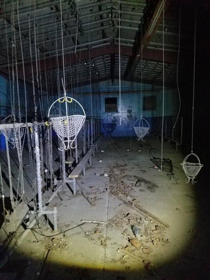 “I found this room in an abandoned building. What could this building have been for and what are these things hanging from the ceiling?”

A: “It’s a miners’ changing room. The hooks and baskets lift their work clothes up and out of the way for the next shift.”