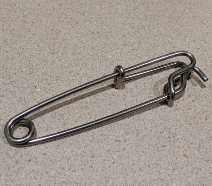 “Possibly a kitchen item? Found it in a bag of kitchen things. It can be compressed by gripping.”

A: “It’s a thing for marine activities and boating called a ‘shark clip’ or longline. It’s a very clever clip to attach things to a line like a buoy. Longline fishermen also use tons of these clips for connecting hooks lines to a long line.”