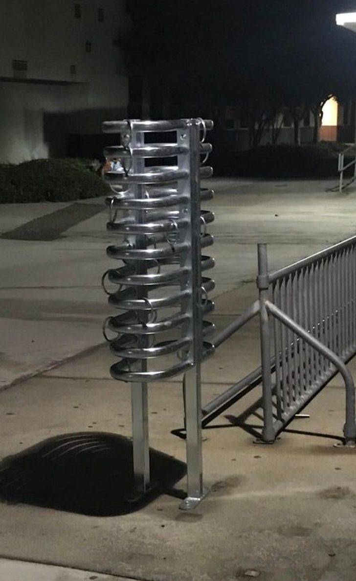 “Saw this at a local school next to a bike rack. What is it?”

A: “It’s a skateboard rack. Slide the board in and put a lock between the rings so it can’t be taken out.”