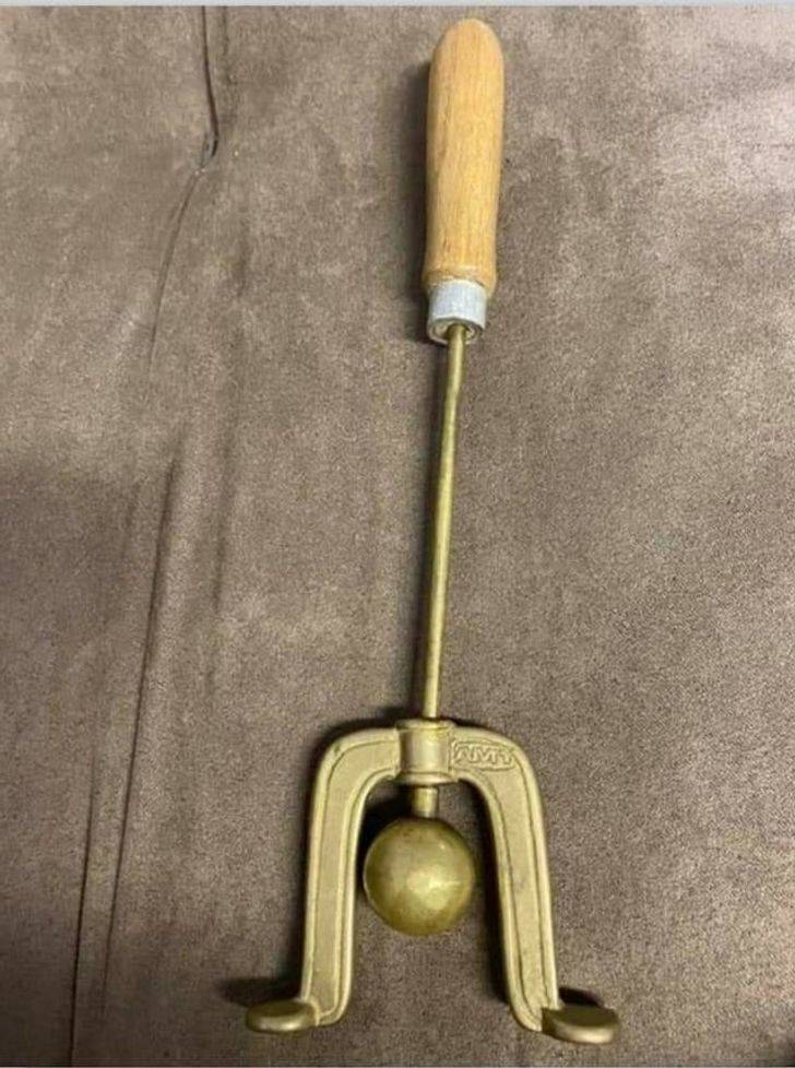 “Found a metal rod with a ball and a U-shaped thing on the end. It has a wooden handle. Any ideas?”

A: “It’s a slide hammer. It’s a pulling tool for removing gears or pulleys off of splines. This looks old and specialized but it’s a slide hammer all the same. Insert the 2 hooks into whatever you want to pull out and rock the metal ball against it to remove it from a tight fit — like the reverse action of a hammer or press.”