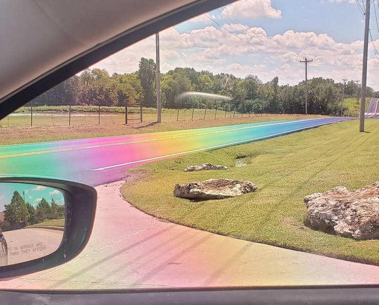 “The sun hit this freshly-paved tarmac just right and made a real-life Rainbow Road through polarized lenses.”