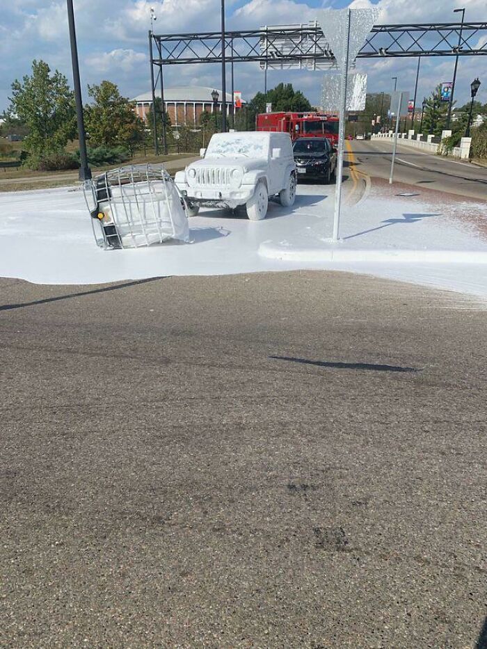 A Truck Carrying A Tank Of White Paint Dropped It On The Road