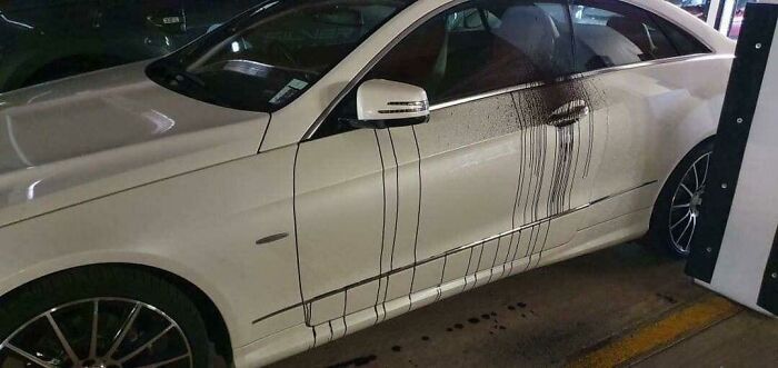 Car After Tarmac Was Being Laid On The Floor Above In A Car Park