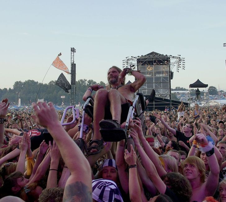 feel good pics -- guy in wheelchair crowdsurfing at concert