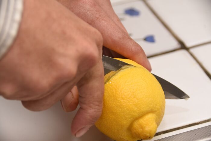 While helping my girlfriend make dinner one night we needed some lemon juice and she asked me to squeeze a lemon. Now logic would dictate you cut the lemon in half before you squeeze the juice out of it, but not this brilliant [guy]. No sir! I just squeezed the [hell] out of it, rolling and palming it in my hand until the peel finally broke, releasing the lemon juice into a bowl as requested. Needless to say, when she turned and saw what I had done she was amazed (probably by my impeccable ability to follow orders). She then asked how I ever managed to live alone, and I'm pretty sure that's why I'm not allowed in the kitchen anymore.