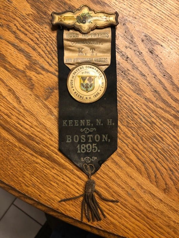 Found this pin in the basement of a house built in the 1800s. Any info on this? I believe it’s connected to the Knights Templar/Freemasons.

A: Boston hosted the triennial conclave (think national convention) for some 20,000 Masons that year, so presumably a sort of delegate ribbon worn by someone from the Knights Templar lodge in Keene who went.